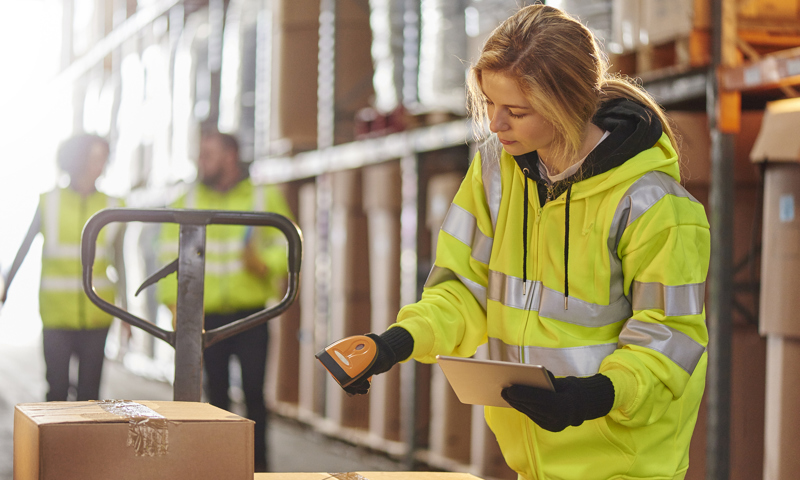 women packing box in warehouse