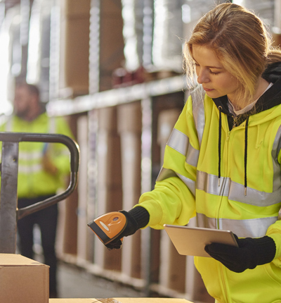 women packing box in warehouse