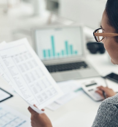 Woman Looking At Spreadsheet