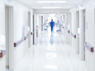 Doctors walking along the hallway in a hospital