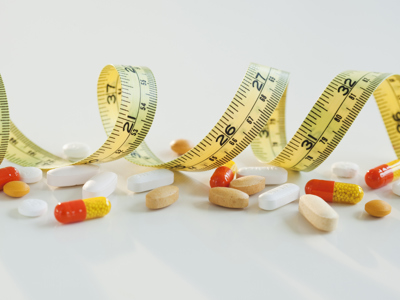 Pills And Tape Measure