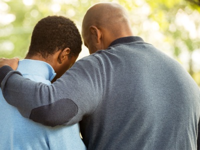 Man Comforting Another