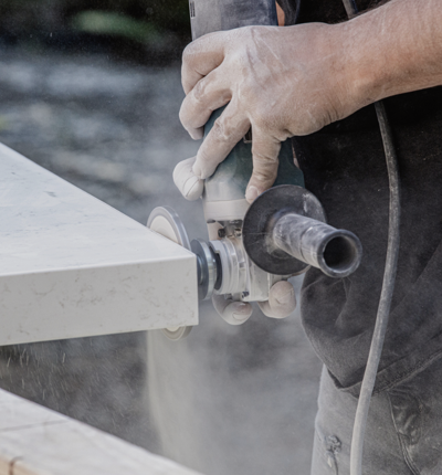 Man working on engineered stone
