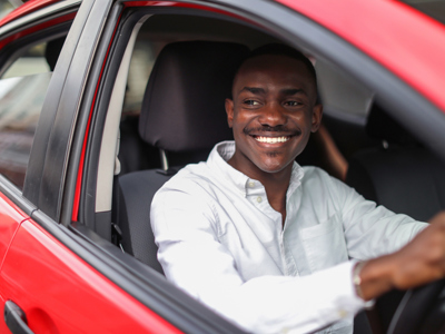 Man at the wheel of a car