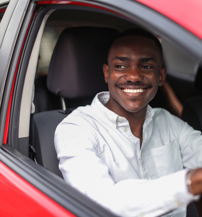 Man at the wheel of a car