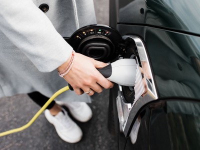 Woman Charging Her Car