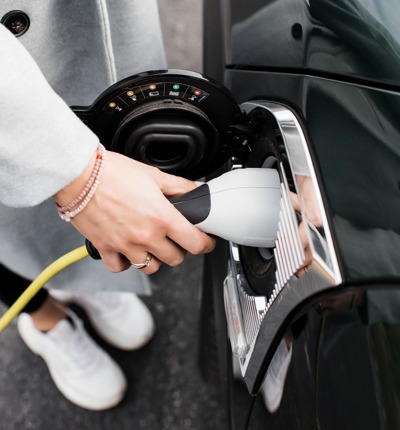 Woman Charging Her Car