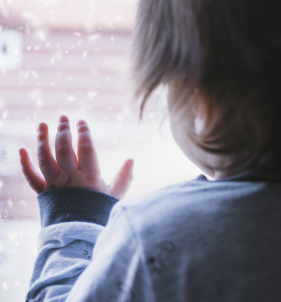 Child looking out of window