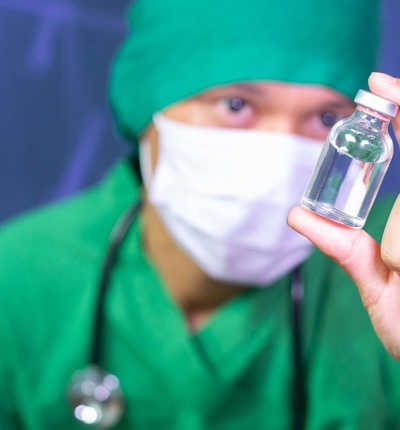 Doctor Holding Vaccine Phial