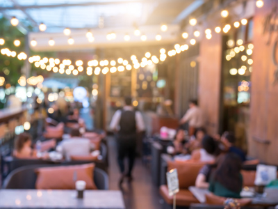 Blurred terrace with tables and chairs