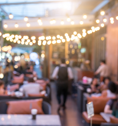 Blurred terrace with tables and chairs