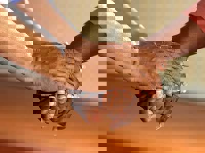 Two People Touching Hands