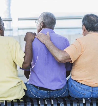 Three Men Offering Comforrt