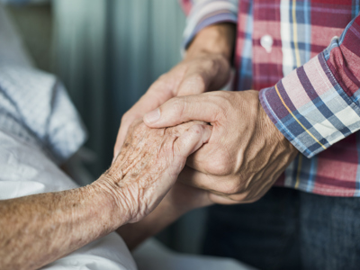 Close up of son holding his mothers hands 493991177