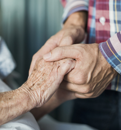 Close up of son holding his mothers hands 493991177