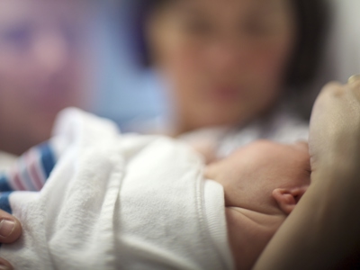 Newborn Parents Blurred Behind