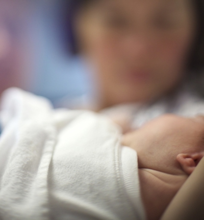 Newborn Parents Blurred Behind