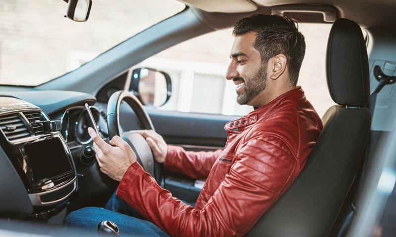 Car Driver Checking Phone