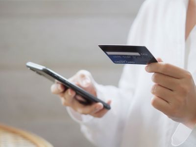 Anonymous person using credit card to make online purchase