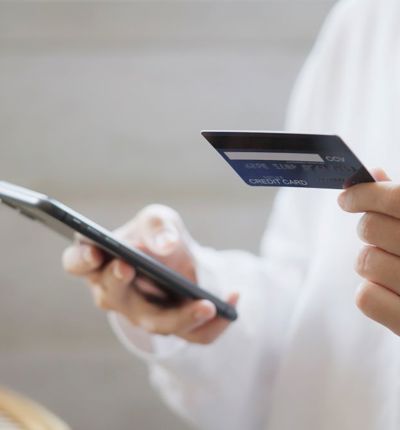 Anonymous person using credit card to make online purchase