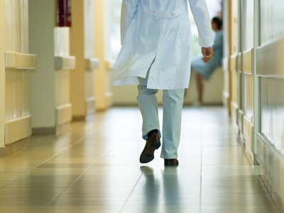 Doctor Walking Down Corridor