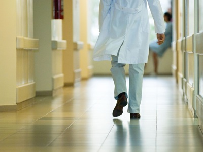 Doctor Walking Down Corridor