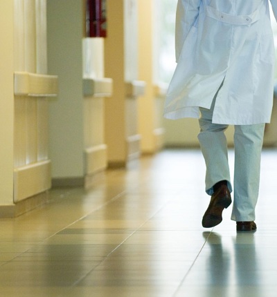 Doctor Walking Down Corridor