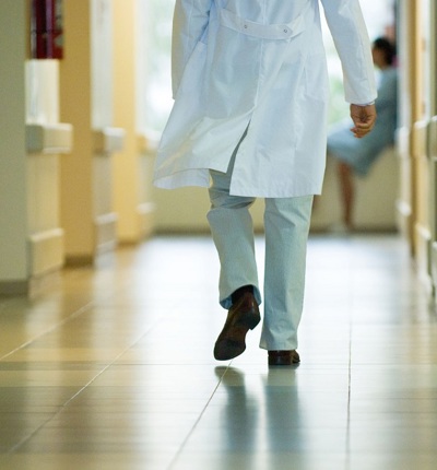 Doctor Walking Down Corridor