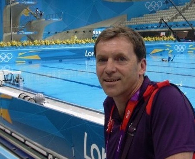 Roland, in front of a swimming pool at the London Olympic games