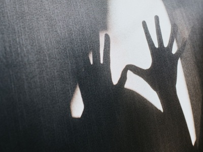 Silhouette of outstretched hands