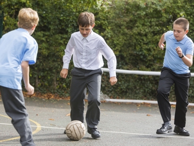 Schoolboys Playing Football