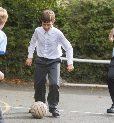 Schoolboys Playing Football
