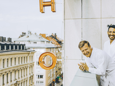 2 men on hotel balcony