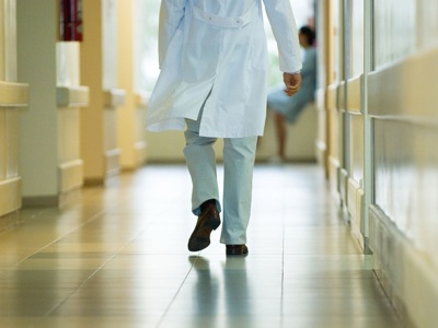 Doctor Walking Down Corridor