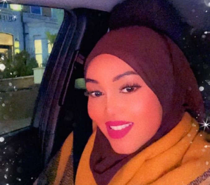Selfie of young hijabi woman in a car