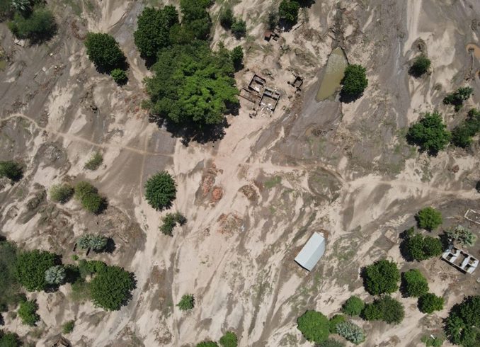 Drone still of Kanseche village following the flood