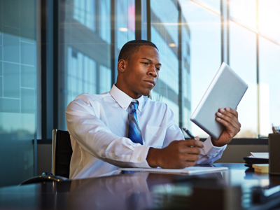 Businessman Looking At A Tablet