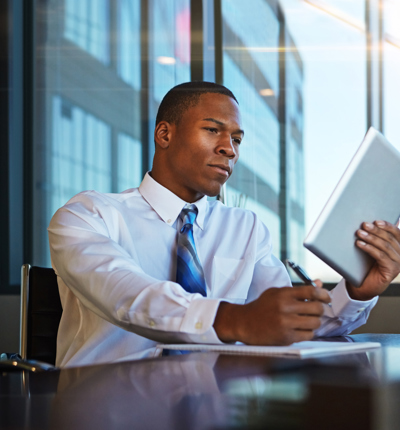 Businessman Looking At A Tablet