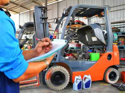 Man Looking At Forklift