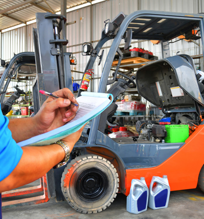 Man Looking At Forklift