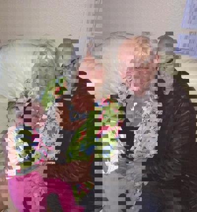 Keith With His Wife Kathleen And Grandchild