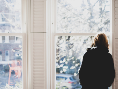 Woman Looking Out The Window