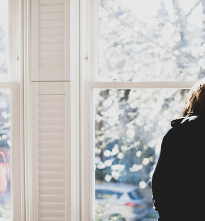 Woman Looking Out The Window