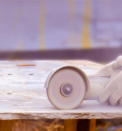 Adobe Express 843642581 Close Up Of The Hands Of A Worker Sawing An Asbestos Slab Resized
