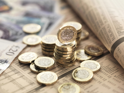 money, Still life of British currency on financial newspaper, close-up