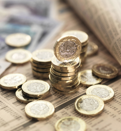 money, Still life of British currency on financial newspaper, close-up