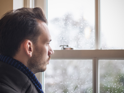 mens health - A man looking out window