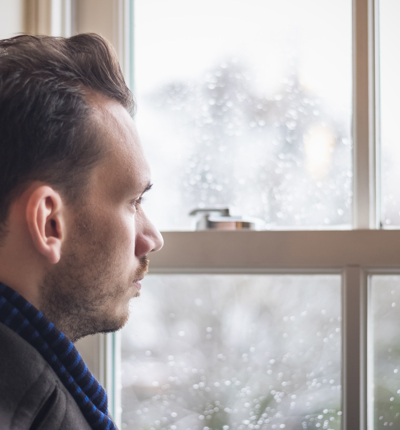 mens health - A man looking out window