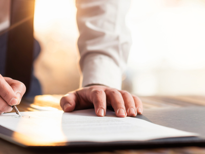 Man Signing A Document