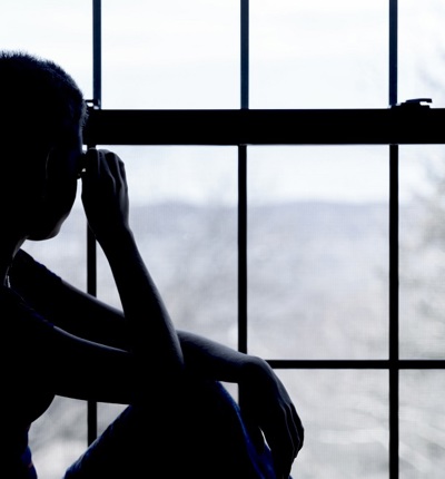 Teen Looking Out Of Window